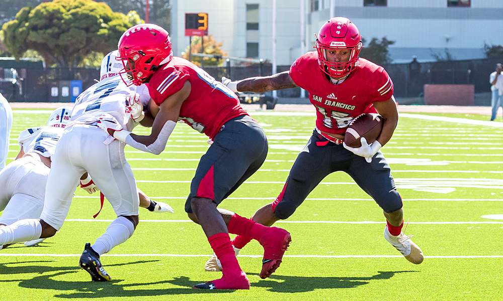Devan Walker (right) ran in for a pair of touchdowns against Santa Rosa. (Photo by Eric Sun)