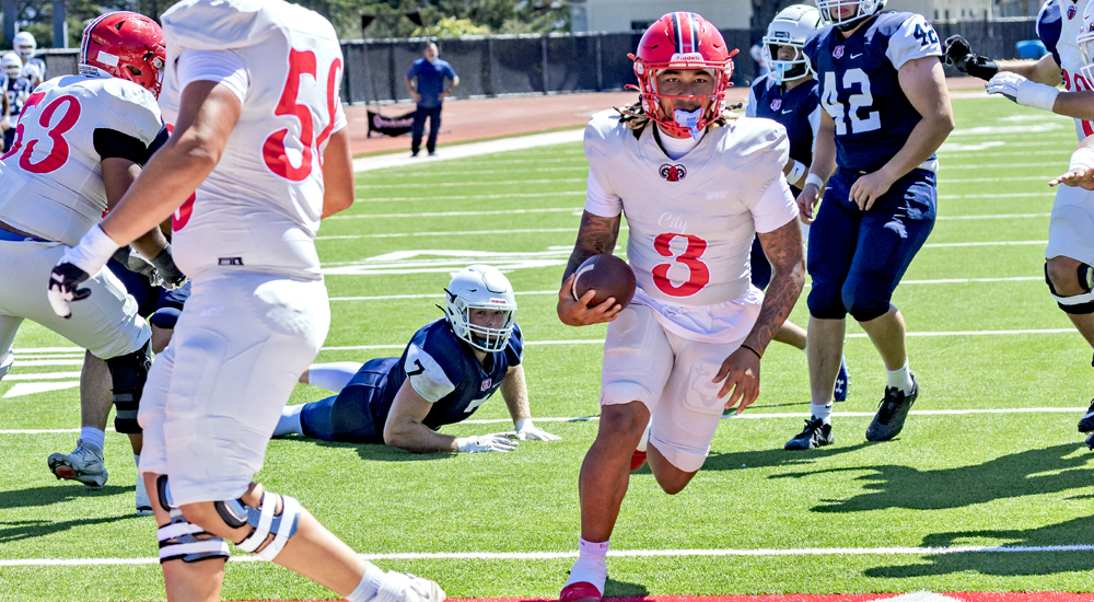 QB Darius Clark-James runs in for a touchdown vs. Santa Rosa. He also tossed 3 TDs. (Photo by  Eric Sun)