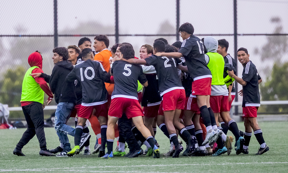 The Rams celebrate following their amazing comeback win. (Photo by Eric Sun)