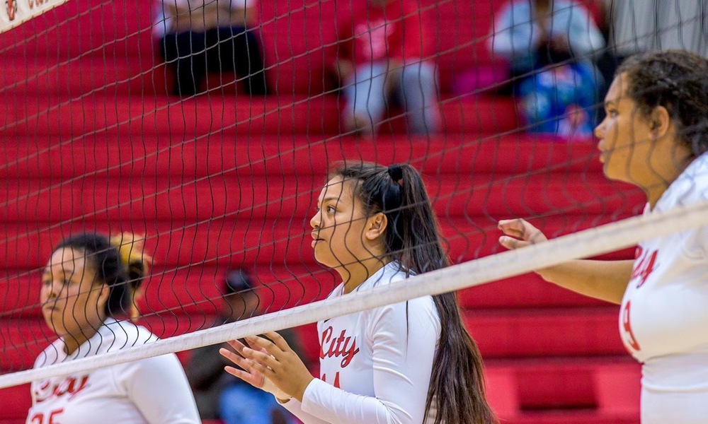 Rams front row readies for a serve